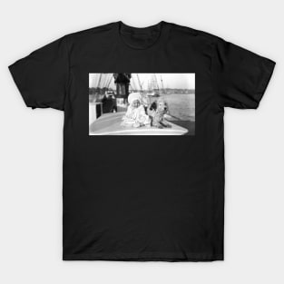 Baby and dog on large boat T-Shirt